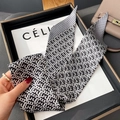 Detail of a black and white geometric silk twilly scarf displayed on a luxury tray - Thin Long Style / Black