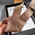 Detail of a silk twilly scarf with brown geometric patterns used as a luxury bag accessory - Thin Long Style / Brown