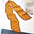 Detail of a bright yellow pleated polka dot scarf used as a stylish bag accessory - 10*130cm / Ginger Yellow