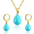 Close-up of gold drop necklace and leverback earrings with blue teardrop stones - Gold Sky Blue Gemstone Style(SE23190DG)
