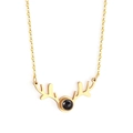 Detailed close-up of golden antler heart pendant with central black projection stone - Antler Style (NE236101) / Steel