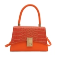 Orange handbag featuring crocodile pattern embossed leather and golden square metal lock - Orange
