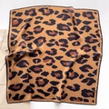 Elegant silk scarf with classic brown leopard print pattern shown with beige blazer - 65x65cm / Caramel color