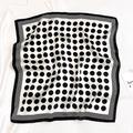 Detailed view of square silk scarf with classic black polka dots and border - 53*53cm / Beige