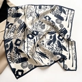 Detail of silk square scarf showing abstract black prints on a cream satin fabric - 53*53cm / Beige Navy