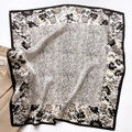 Elegant floral silk square scarf with black borders, styled with a beige blazer - 65*65cm / Black Border Floral