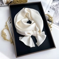 Elegant off-white silk scarf tied in a bow knot inside a black gift box packaging - 15*150cm / Cream