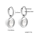 Detail view of silver stainless steel hoop earrings with oval shell inlay and measurements - Earrings (EA58390AS) / Steel