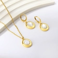 Gold necklace and earrings set with oval white shell inlays on a display stand - Earrings Necklace Set / Gold
