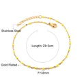 Dettaglio della cavigliera in acciaio placcato oro 23+3cm con perline gialle da 1,8mm - Catena d'oro con perline gialle