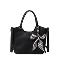 Fashionable black pebbled leather bucket bag with geometric silk scarf and gold hardware - Black