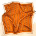 Orange silk scarf with black stripes and gold chain pattern for women in equestrian style - Orange