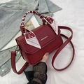 Deep red pebbled leather crossbody bag with silk scarf wrapped handle and flap cover - Red