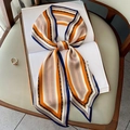 Elegant geometric stripe long silk scarf tied in a bow on a vintage book - Style 34