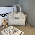 Elegant cream lychee pattern handbag with wavy edge and metallic silver rotary lock - Off White