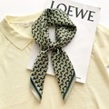 Elegant geometric silk scarf with green and blue patterns shown in a stylish knot - 65*65cm / Matcha Green