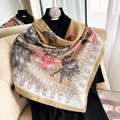 Close-up of elegant floral print silk square scarf with golden border and satin finish - 90*90cm / Khaki