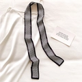 Detailed view of a black and white houndstooth skinny scarf on a satin dress - Black and White Houndstooth Pattern (DT-15)
