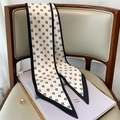 Close-up of a black and white twilly scarf with letter pattern on a leather chair - 15*150cm / White with Black Border (FX-174)