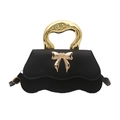 Chic black mini crossbody bag with gold metal wave handle and bow detail - Black