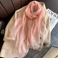 Pink semi-transparent silk blend scarf with subtle glitter stripes on a beige coat - Pink