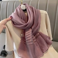 Elegant purple silk blend scarf with translucent stripes hanging on a golden hook - Taro Purple