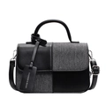 Bolso bandolera en contraste negro y gris con costuras de cuero y asa superior - Negro