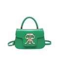 Modern bright green leather handbag with distinctive gold crown buckle and adjustable strap - Green
