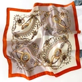 Detail of vintage chain print silk scarf with orange borders and satin finish texture - Orange Border Style