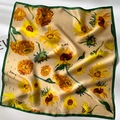 Close-up of silk square scarf featuring Van Gogh sunflower print and green stitched edges - Square Scarf / Sunflower Print - Khaki