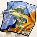 Detailed close-up of a silk square scarf with crane and floral prints on a blazer - Aqua Blue Yellow (ZS-161) / 55x55cm
