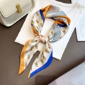 Detail of silk scarf with blue and orange geometric print styled on a white t-shirt - 70*70cm / Yellow
