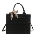Large black quilted tote bag with elegant patterned silk scarf on the top handle - Black