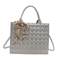 Silver quilted tote bag with metallic finish and decorative scarf handle wrap - Silver