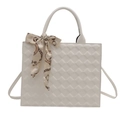 Off-white quilted faux leather tote bag with elegant scarf accent and slim strap - White