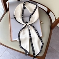 Elegant ivory twilly silk scarf with black floral print tied as a decorative bow - Letter Rose Off-White (FX-33-White)