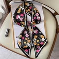 Floral print narrow silk scarf tied in a bow on a magazine for women's fashion styling - Black Floral