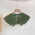 Detail of forest green lace shawl with heart patterns and elegant pearl button closure - One Size / Green