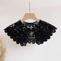 Close-up of black hollow lace collar with a central white pearl button on a wooden hanger - One Size / Black