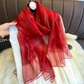 Detail of red silk blend scarf with metallic gold thread and white camellia flower - Red