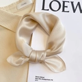 Detail of champagne silk scarf with pearl luster finish and fine stitched edges - 53*53cm / Apricot