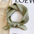 Detail of elegant olive green silk scarf with smooth satin texture in a knotted style - 53*53cm / Light Green