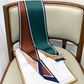 Polka dot silk scarf on a wooden chair with magazine and pearl ring detail - Peacock Blue Coffee