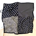 Detail of silk scarf with black and white paisley and polka dot patchwork design - Black