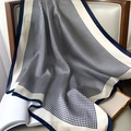 Detail of navy blue houndstooth silk scarf elegantly draped on a classic armchair - 70x70cm / Navy Blue Houndstooth (W-175)
