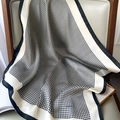 Close-up of black and white houndstooth silk scarf with elegant satin borders - 70x70cm / Black Houndstooth (W-175)