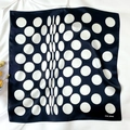 Detailed flat lay of a black and white polka dot silk scarf with elegant brand logo - 53*53cm / Black