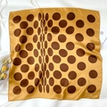 Detail shot of a yellow silk scarf with brown polka dots on a white background - 53*53cm / Ginger Yellow