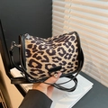 Fashionable leopard print crossbody bag with black trim and adjustable leather shoulder strap - Khaki Leopard