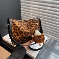 Retro leopard print crossbody bag with a fuzzy monster keychain and matte finish - Brown Leopard with Charm